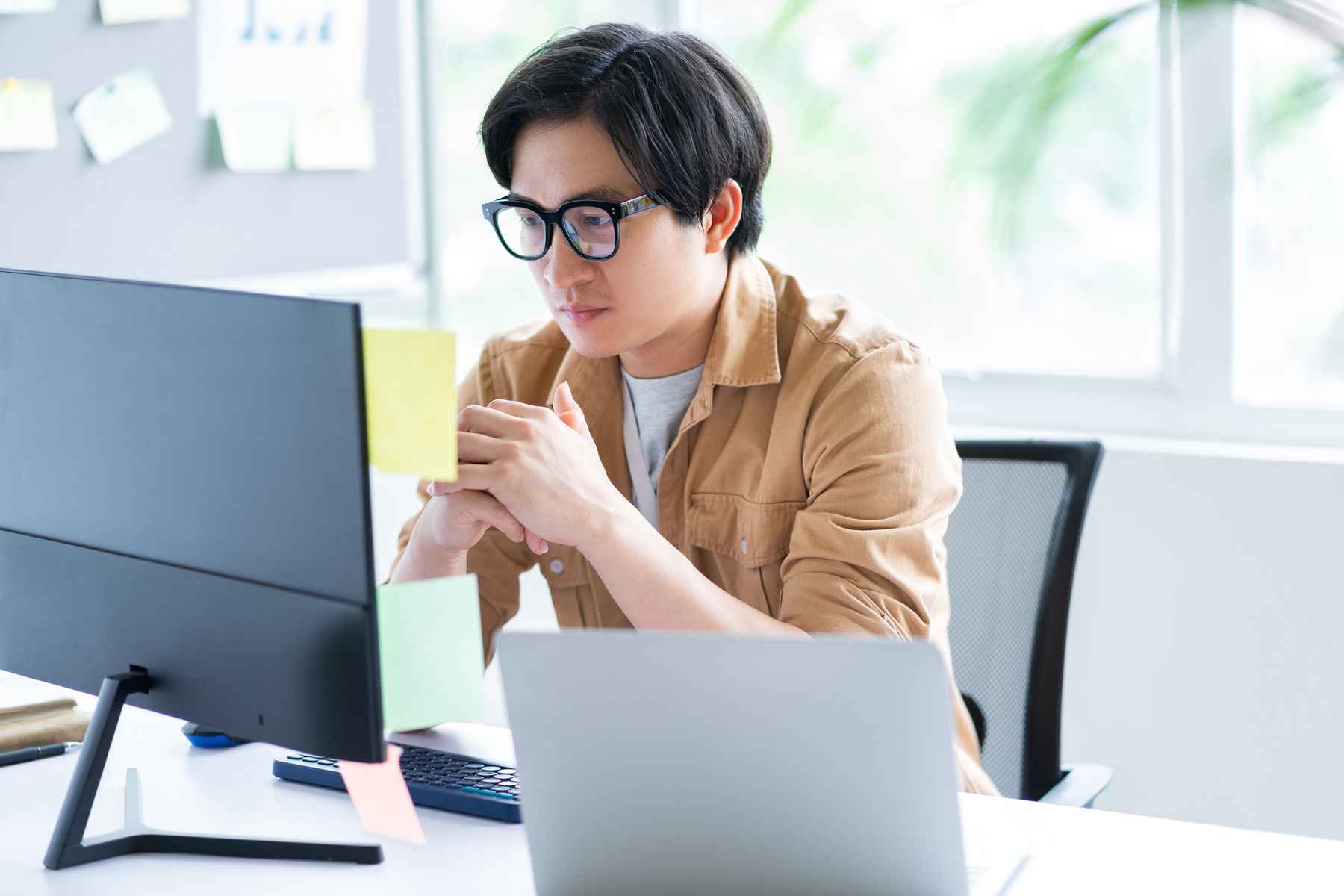 Asian Business Man Working with Computer in Office